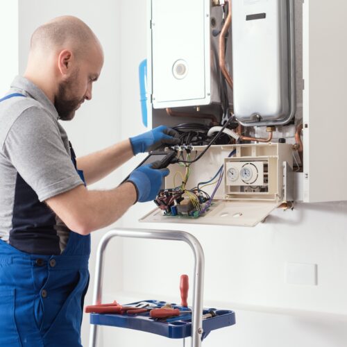 Qualified,Engineer,Checking,Flue,Gas,Emissions,On,A,Domestic,Gas